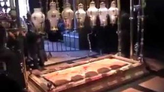 blood is leaking from the stone Jesus body was laid before his burial